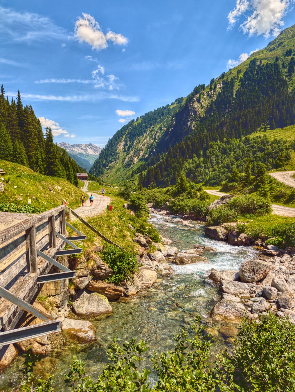 Wooden bridge over a river on the way towards Verwallsee